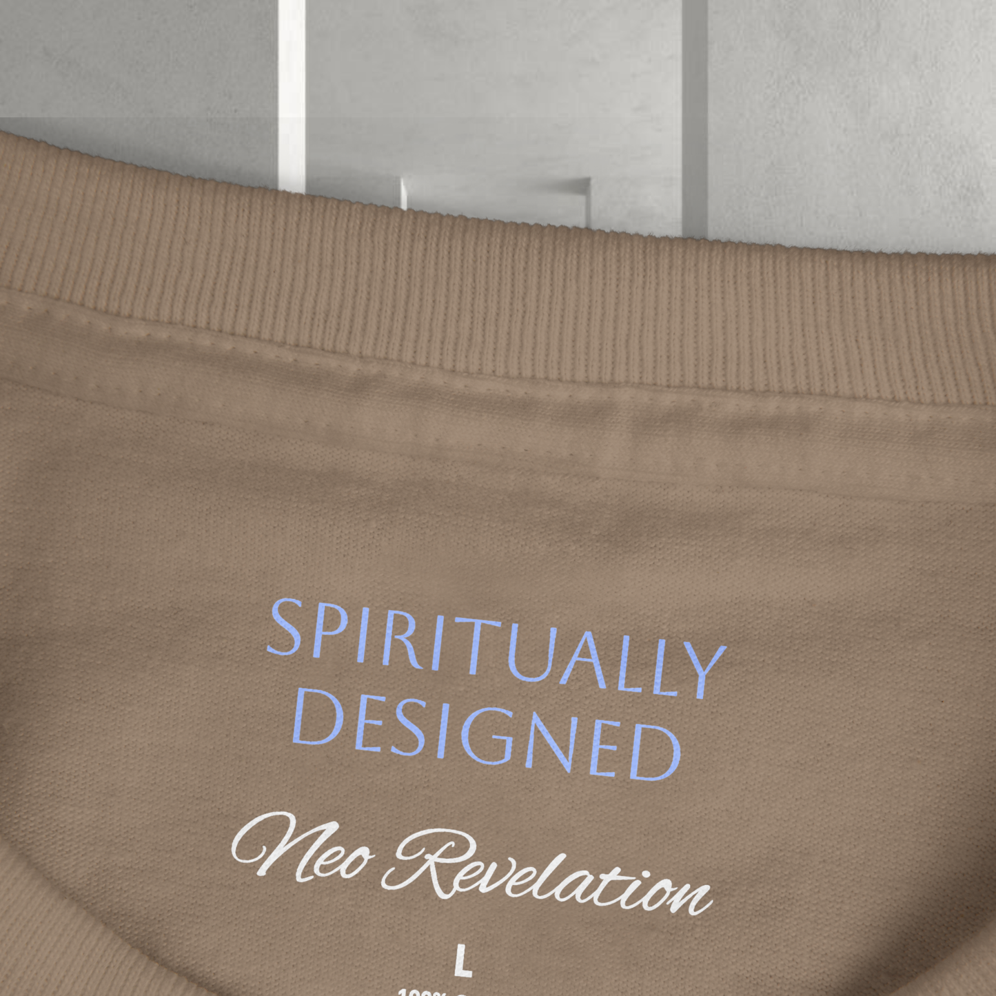 for Neo Revelation Brand spiritual clothing fashion designsthe necklabel presented on a grey ethereal background the words ' spiritually designed' and 'Neo Revelation' on the necklabel