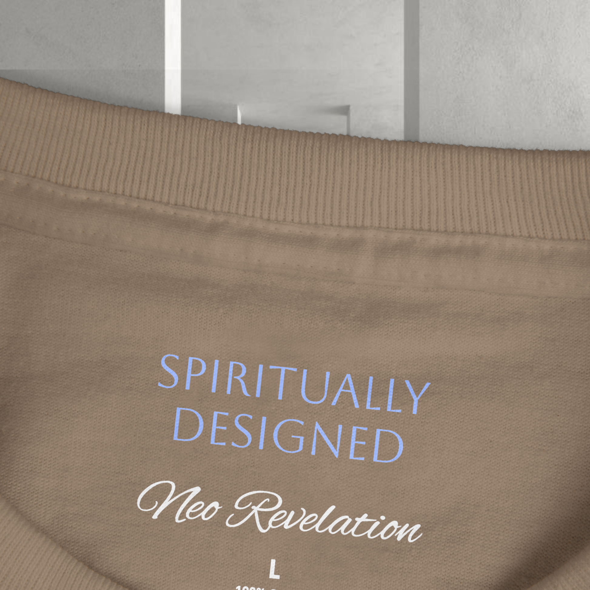 for Neo Revelation Brand spiritual clothing fashion designsthe necklabel presented on a grey ethereal background the words ' spiritually designed' and 'Neo Revelation' on the necklabel