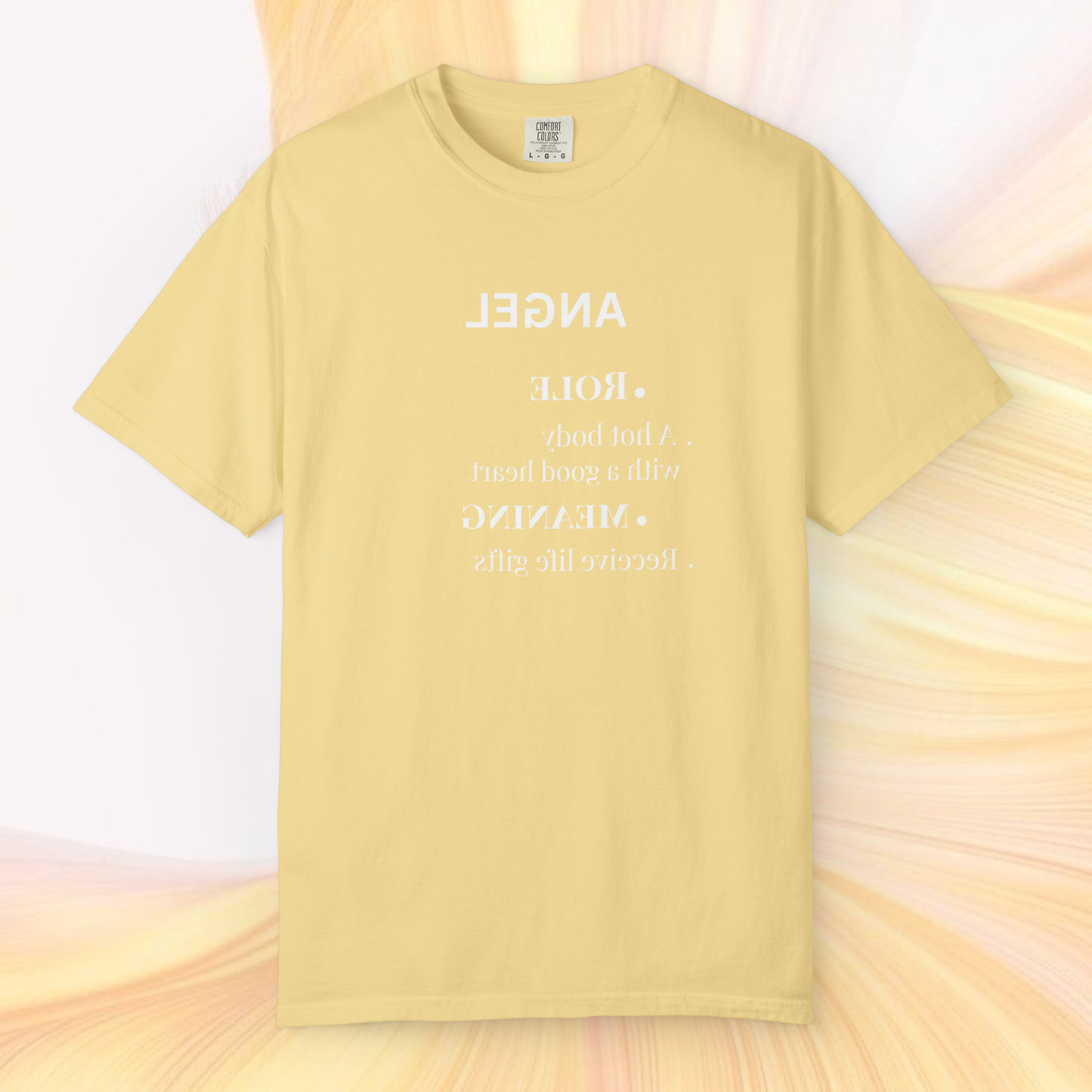 soft yellow t-shirt 100% cotton tee with the graphic written in reverse mirrored 'angel' signification text in white on a light yellow white ethereal background spiritually designed clothing line fashion 2026
