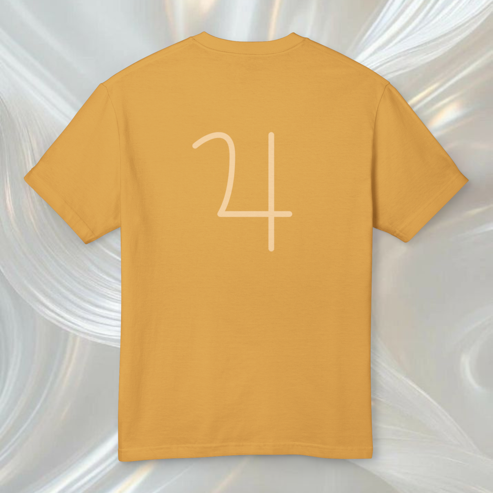 organic cotton t-shirt yellow orange color with the graphic symbol of jupiter planet minimalist style, Neo Revelation brand spiritually designed fashion clothes the yellow tee is on a white ethereal background