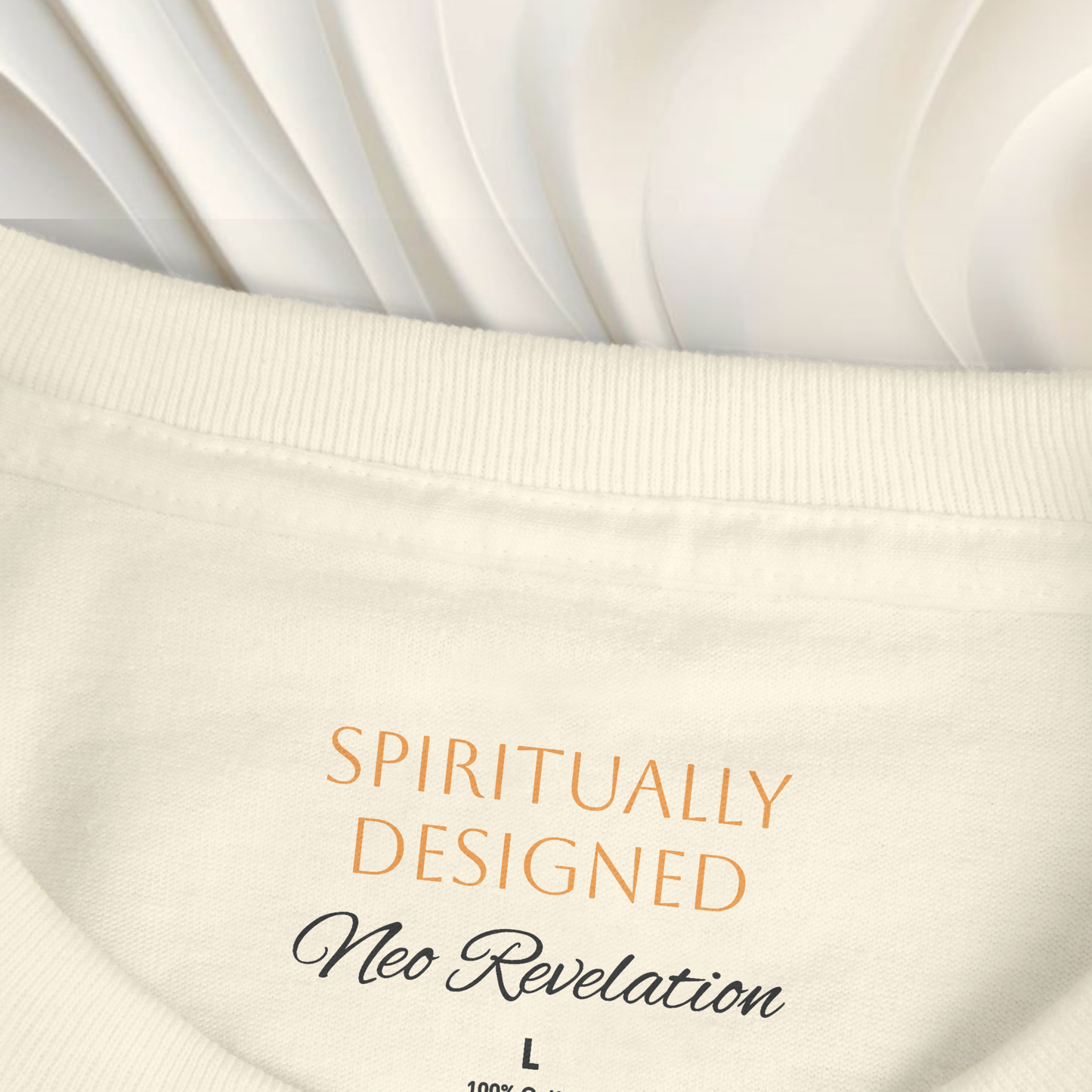 necklabel white t-shirt cotton with the words ' spiritually designed' printed on it and 'neo revelation' on a white ethereal background